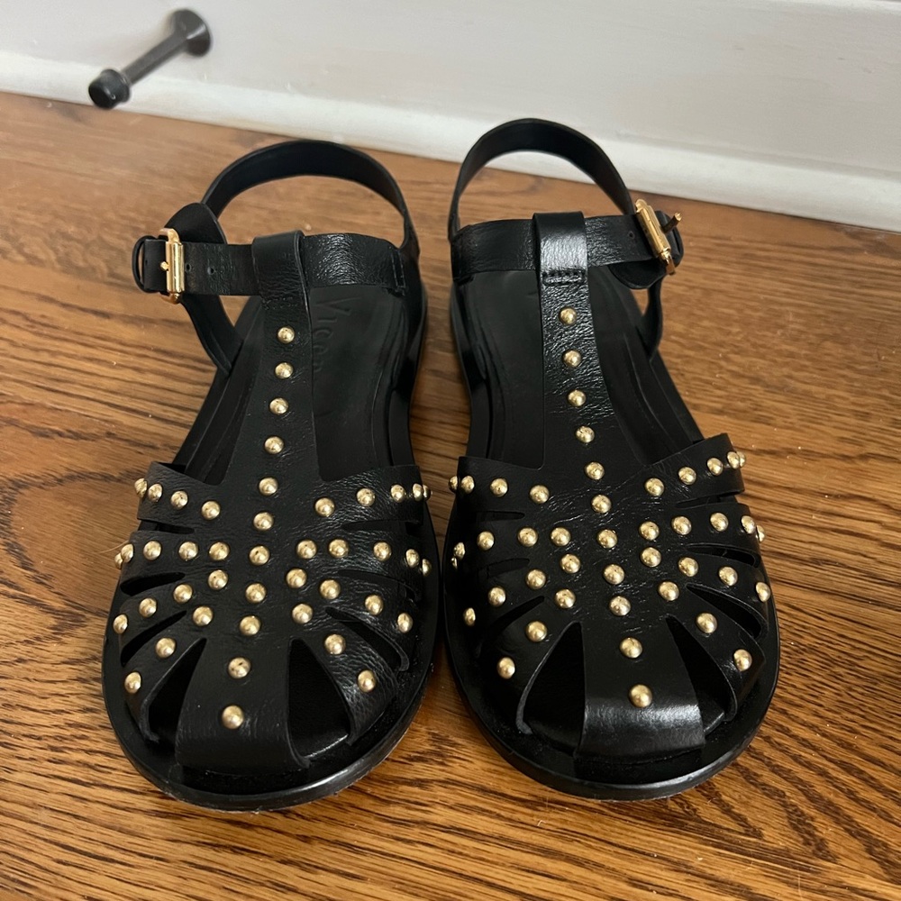 Elegant Black and Gold Sandals with Sleek Design